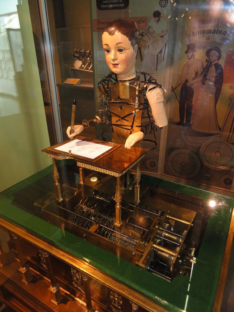 Henri Maillardet's writing automaton, a mechanical figure holding a pen over paper.