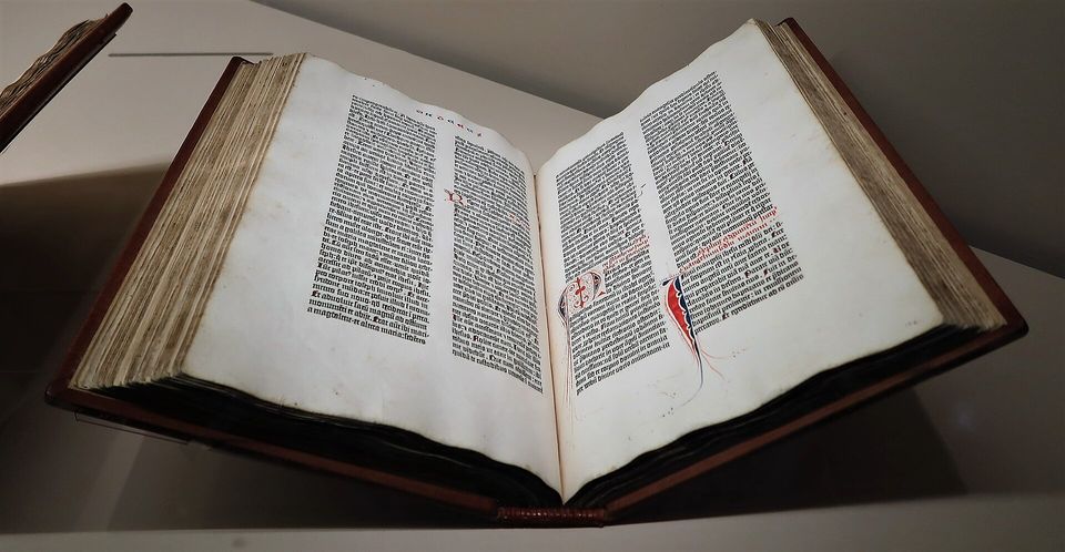 An open Gutenberg Bible on display.