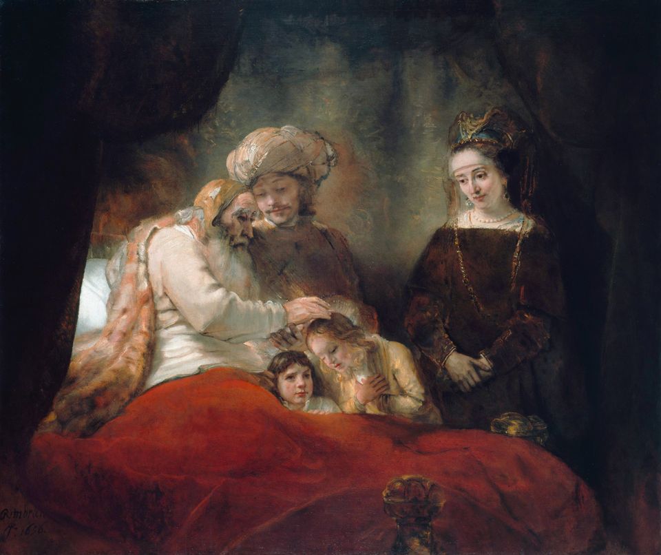An aged Jacob, propped up in bed, rests his hand on the head of his young grandson to bless him, while Joseph and his wife Asenath look on.