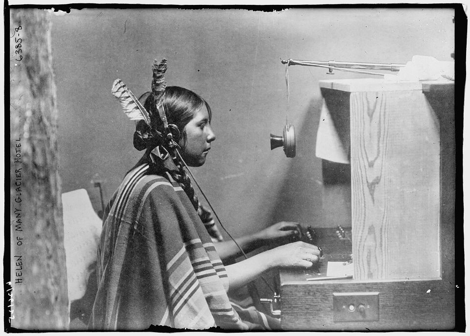 A telephone operator at a hotel switchboard in 1925.